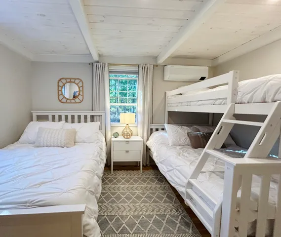 a bed room with a bed and a couch