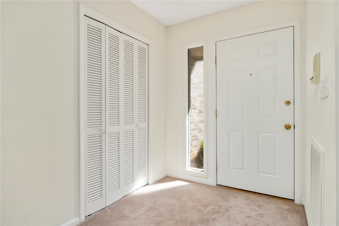 34 Hickory Way Clemson, SC 29631 - Photo 8 of 39 A well-lit entry with plush carpet and a convenient closet, welcoming you home.