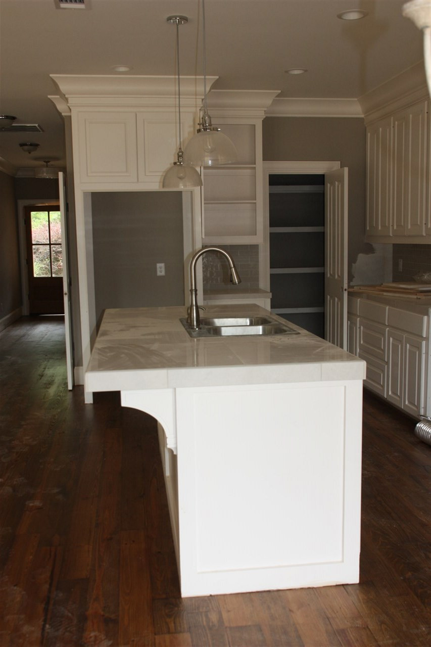 307 Rue Chateau Ridgeland, MS 39157 - Photo 5 of 13 Lots of cabinets and a sink in island.