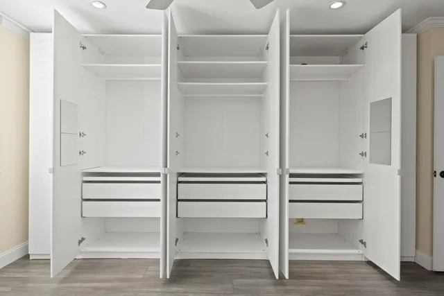 a view of an empty walk in closet