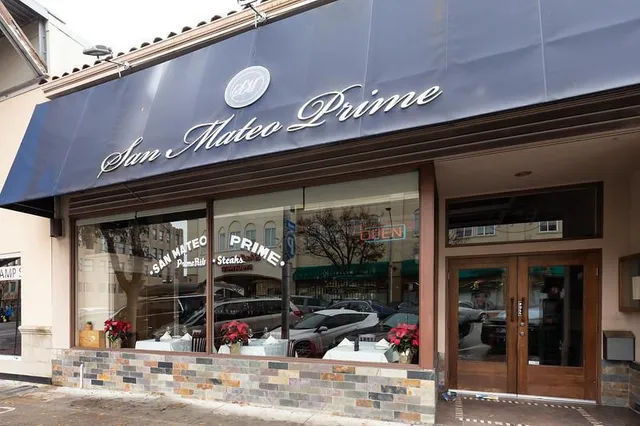 a view of a shop in a street