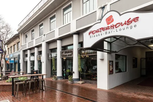 a view of a building with retail shops and retail shops