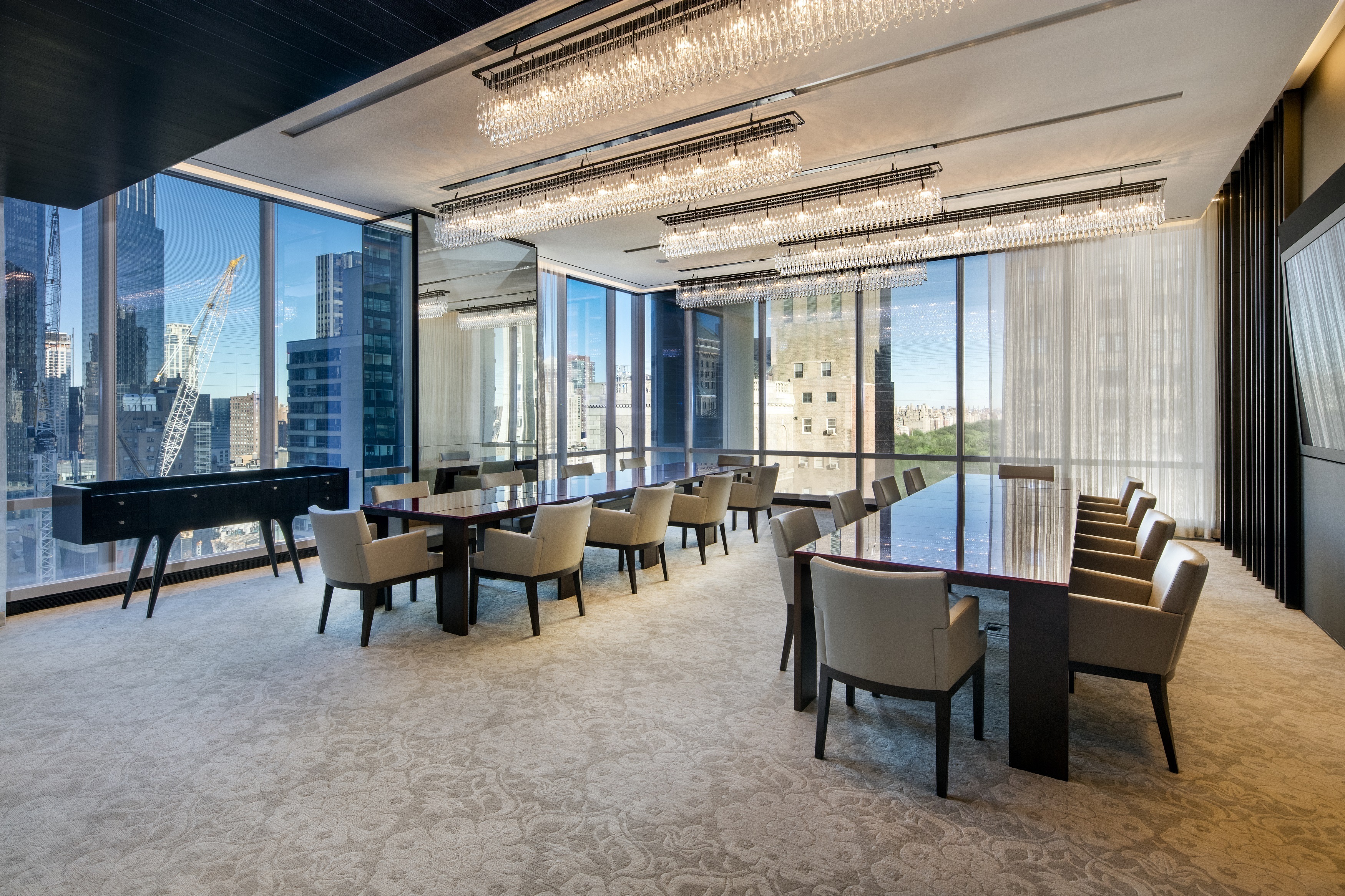157 West 57th Street, Unit 32T Manhattan, NY 10019 - Photo 7 of 11 a view of a livingroom with furniture and window