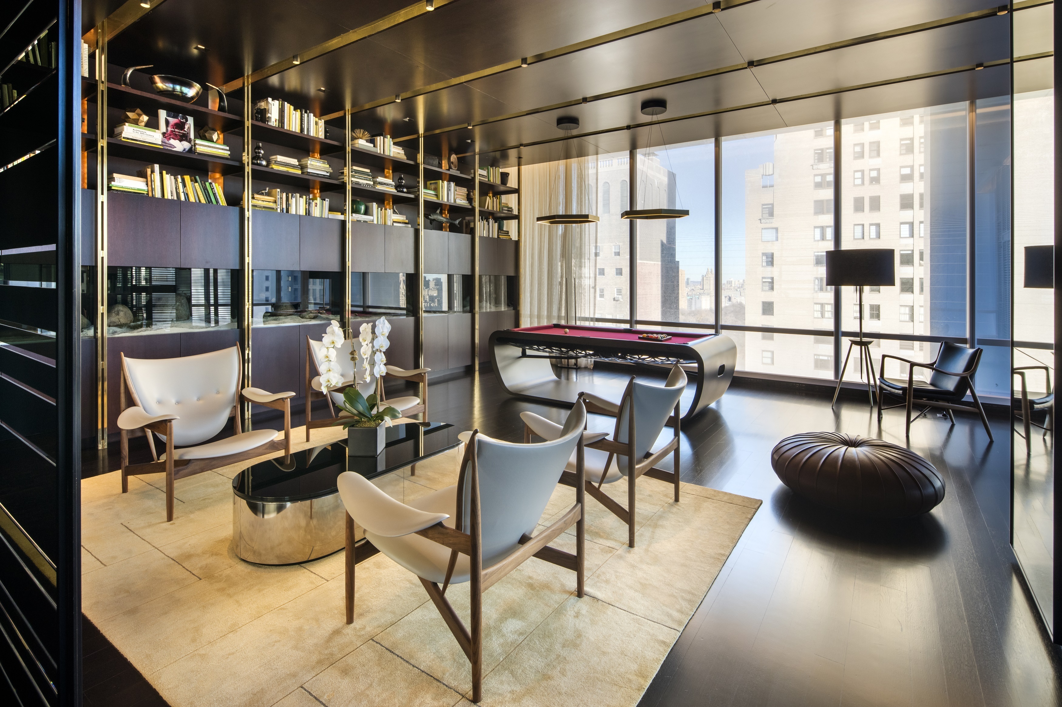 157 West 57th Street, Unit 32T Manhattan, NY 10019 - Photo 9 of 11 a living room with patio furniture and a large window