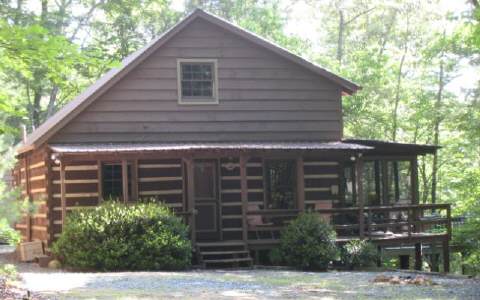 4 Delta Lane Blue Ridge, GA 30513 - Photo 1 of 1 a front view of a house with garden