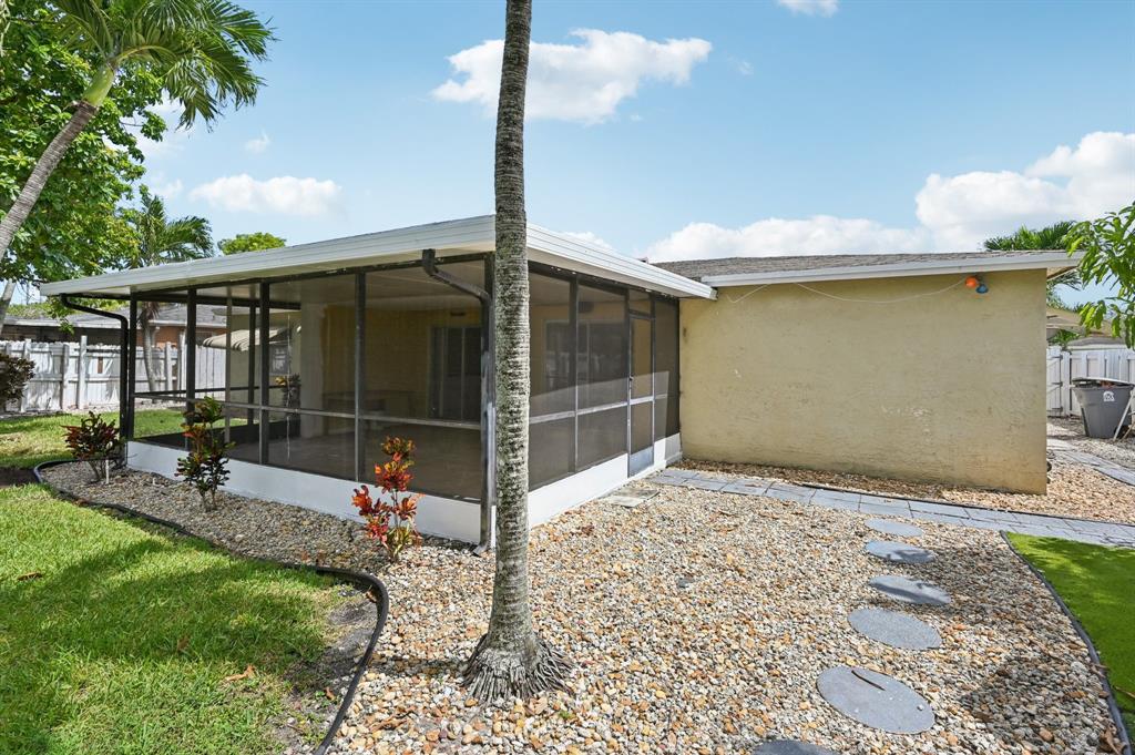 4549 Baldric Street Boca Raton, FL 33428 - Photo 13 of 43 a house view with a garden space