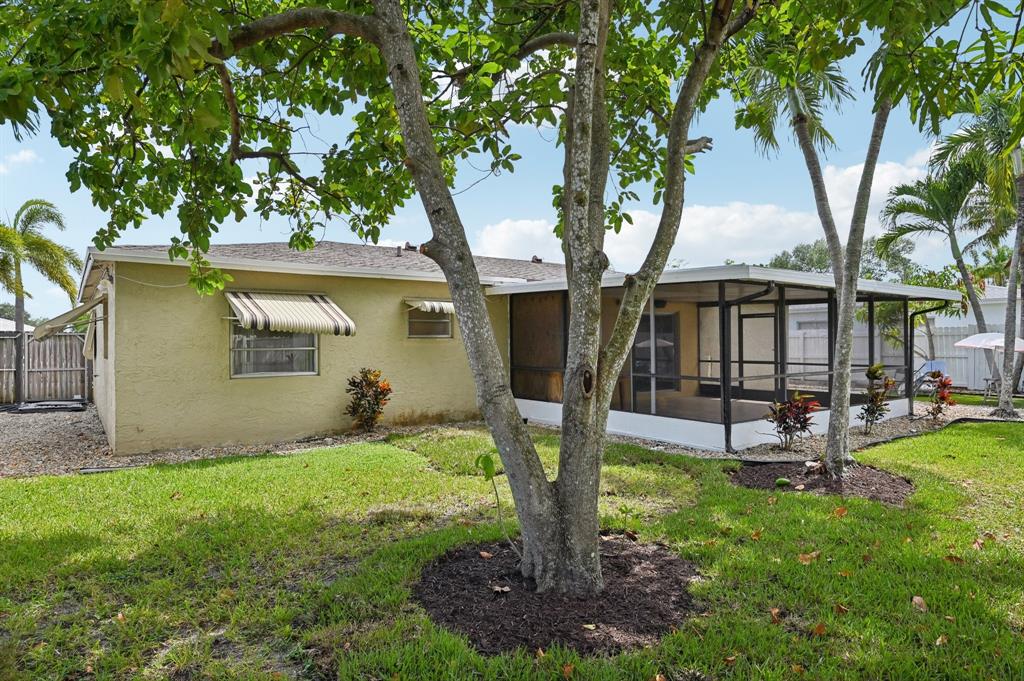 4549 Baldric Street Boca Raton, FL 33428 - Photo 15 of 43 a view of a house with a backyard