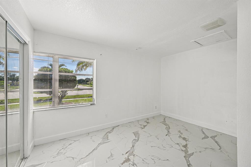 4549 Baldric Street Boca Raton, FL 33428 - Photo 24 of 43 an empty room with window