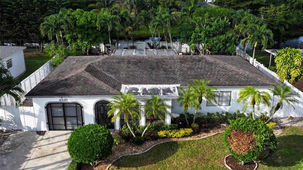4549 Baldric Street Boca Raton, FL 33428 - Photo 3 of 43 a aerial view of a house with garden space and sitting area