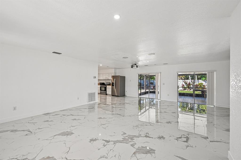 4549 Baldric Street Boca Raton, FL 33428 - Photo 32 of 43 a view of work space with wooden floor and furniture