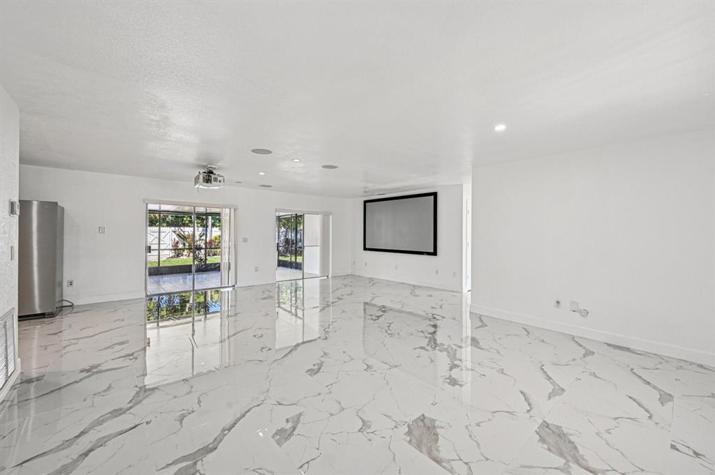 4549 Baldric Street Boca Raton, FL 33428 - Photo 33 of 43 a view of a hallway with wooden floor and a living room