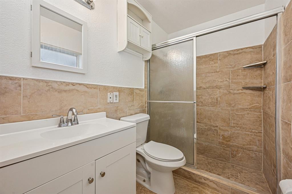 4549 Baldric Street Boca Raton, FL 33428 - Photo 36 of 43 a bathroom with a sink mirror and a toilet