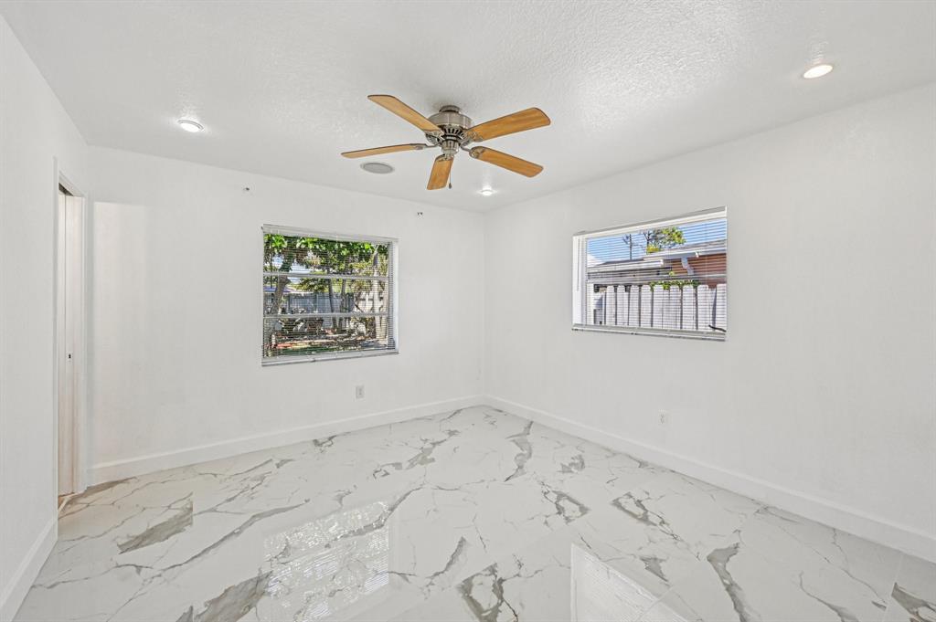 4549 Baldric Street Boca Raton, FL 33428 - Photo 37 of 43 wooden floor in a empty room with a window