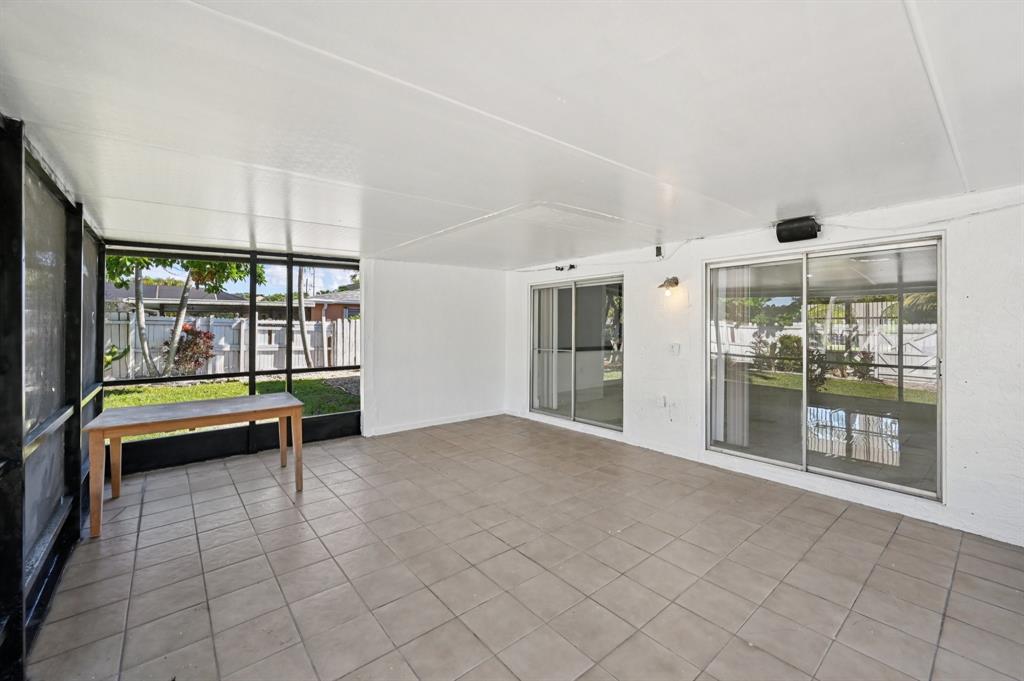 4549 Baldric Street Boca Raton, FL 33428 - Photo 40 of 43 a swimming pool with outdoor seating and yard