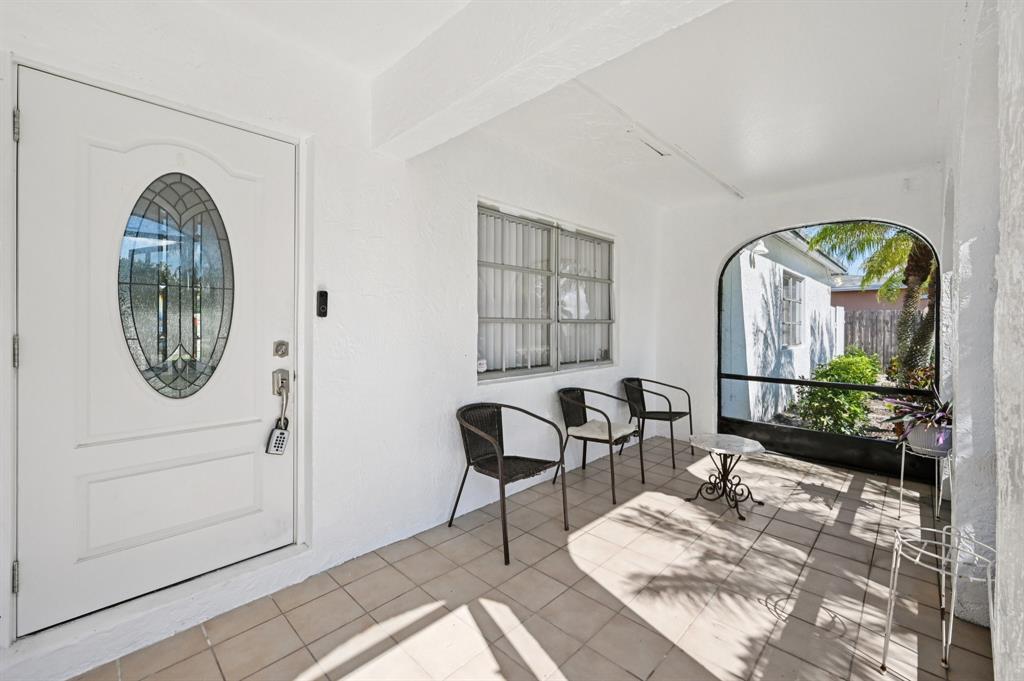 4549 Baldric Street Boca Raton, FL 33428 - Photo 43 of 43 a view of a livingroom with furniture and front door