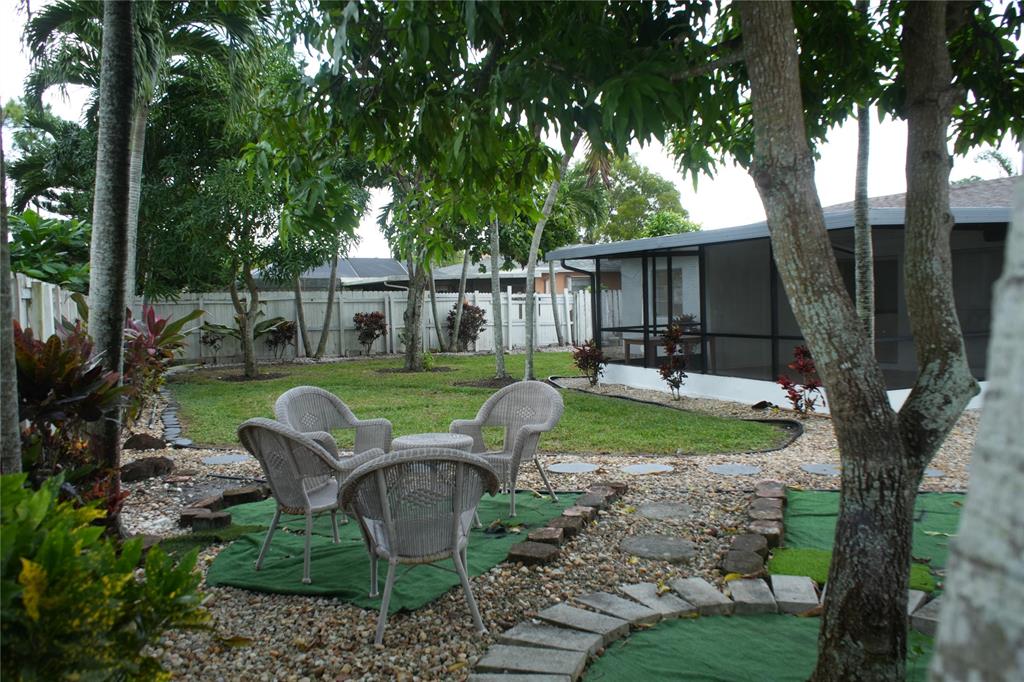 4549 Baldric Street Boca Raton, FL 33428 - Photo 6 of 43 a view of a house with backyard and sitting area