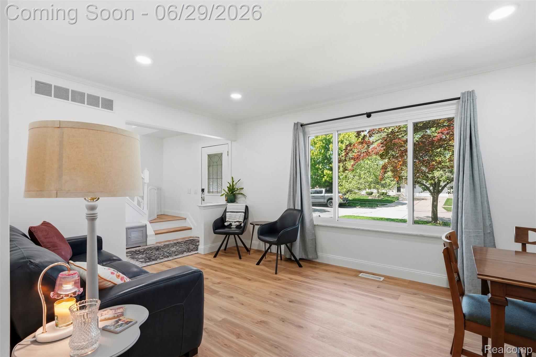 45179 Rudgate Road Canton, MI 48188 - Photo 5 of 48 Bright living area featuring wood-finish flooring, recessed lighting, and a large picture window