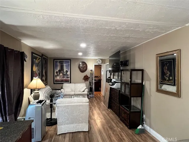a view of a living room with furniture and a window