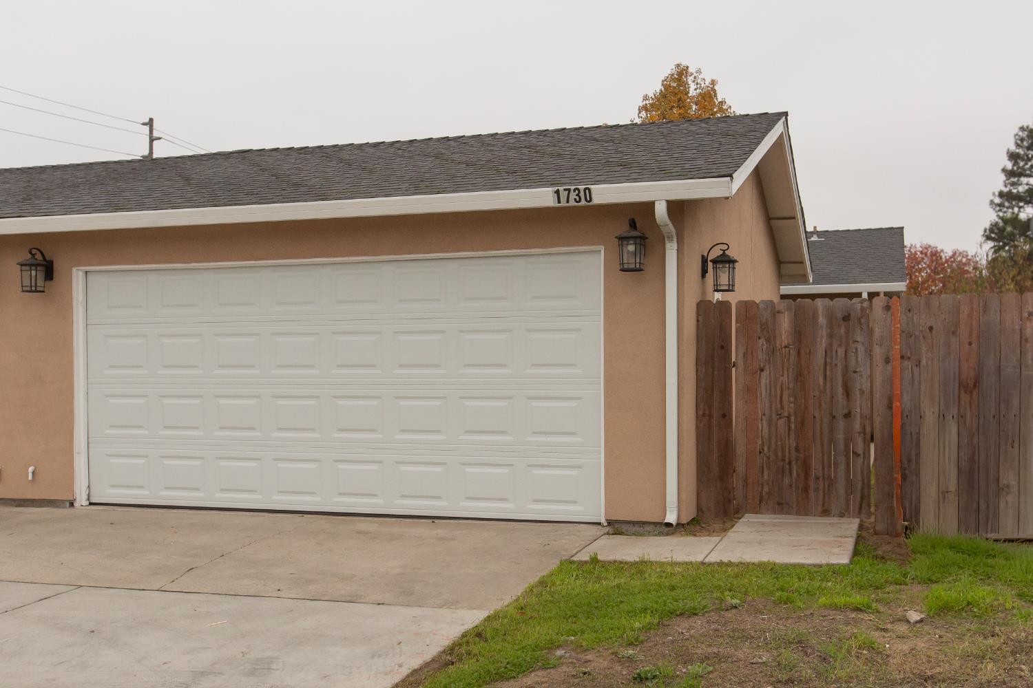a front view of a house with a garage