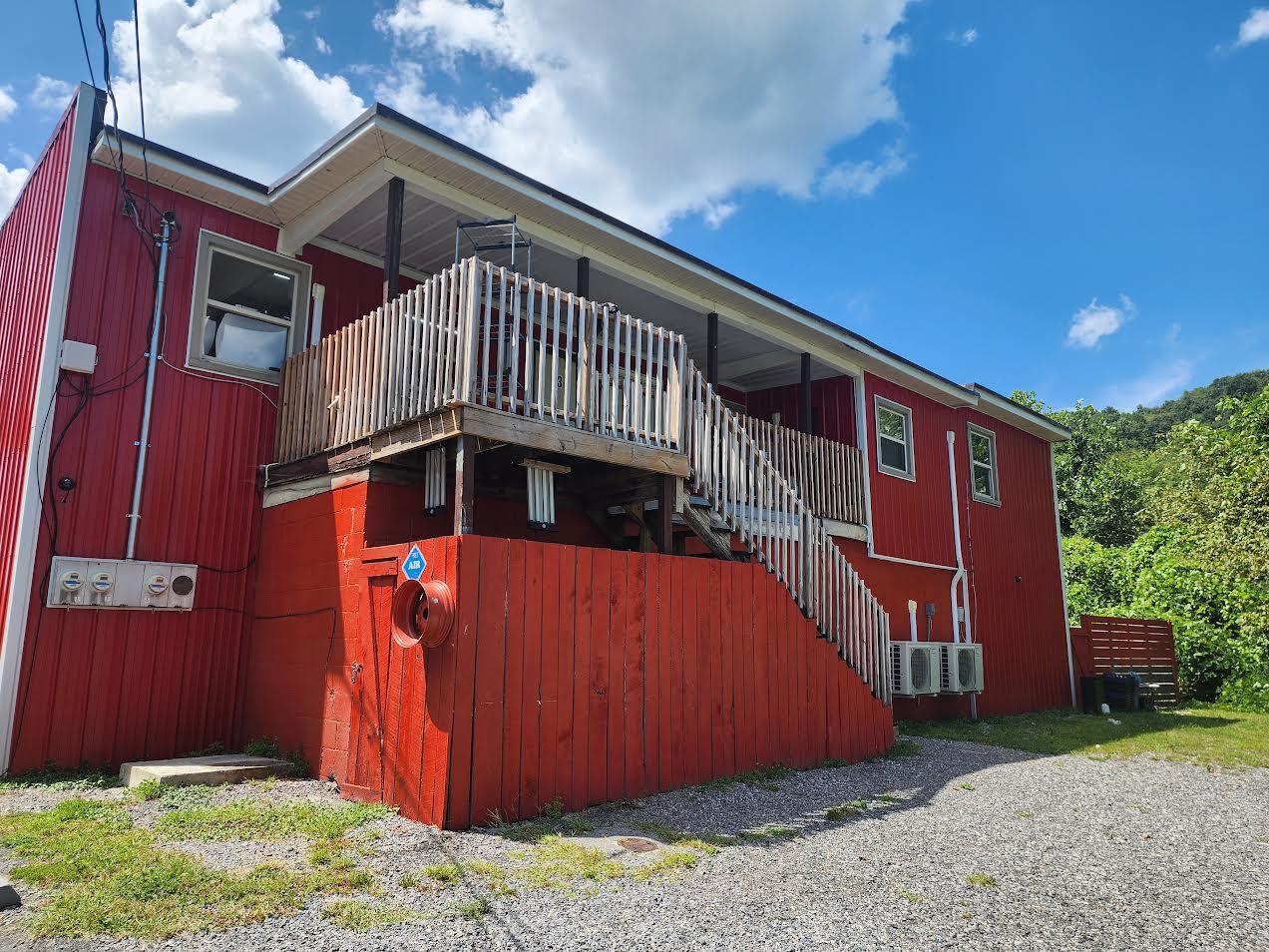 159 Bottom Road, Unit 4 Raven, VA 24639 - Photo 11 of 13 a front view of a house with garden