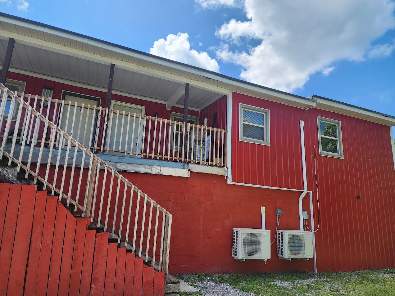 159 Bottom Road, Unit 4 Raven, VA 24639 - Photo 12 of 13 a view of a balcony with door and wooden floor