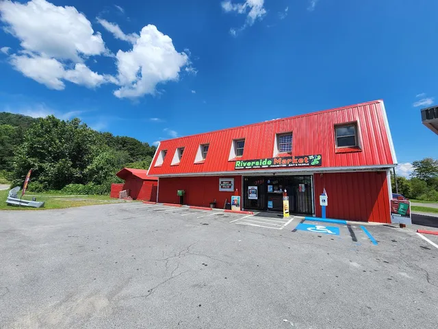 a view of a house with a yard and a garage