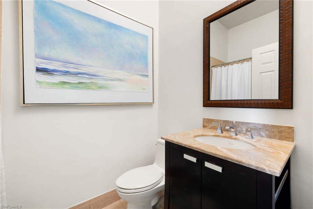 2153 Paget Circle Naples, FL 34112 - Photo 23 of 49 Full bath with vanity and a shower with curtain