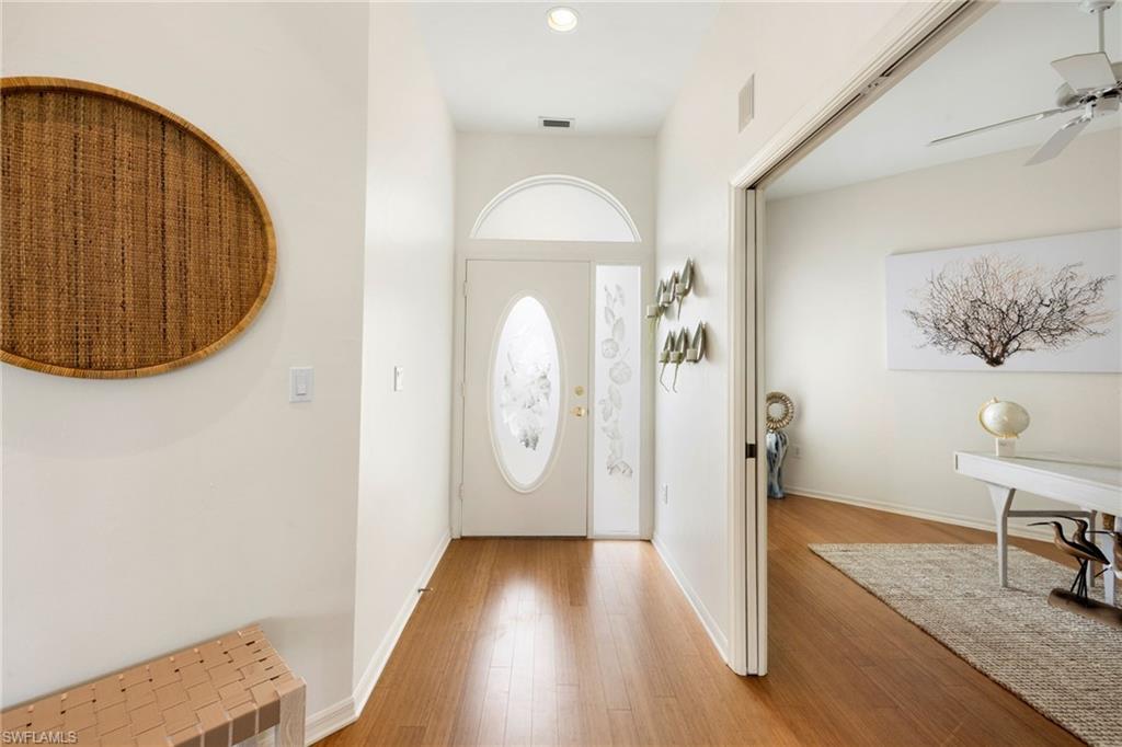 2153 Paget Circle Naples, FL 34112 - Photo 24 of 49 Foyer entrance featuring light wood-type flooring and a ceiling fan