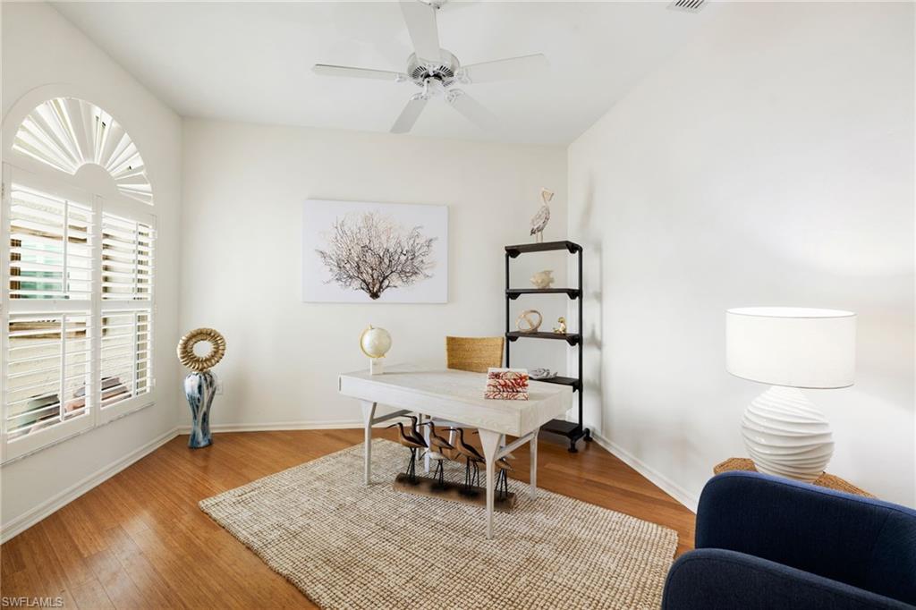 2153 Paget Circle Naples, FL 34112 - Photo 25 of 49 Home office with wood finished floors and a ceiling fan