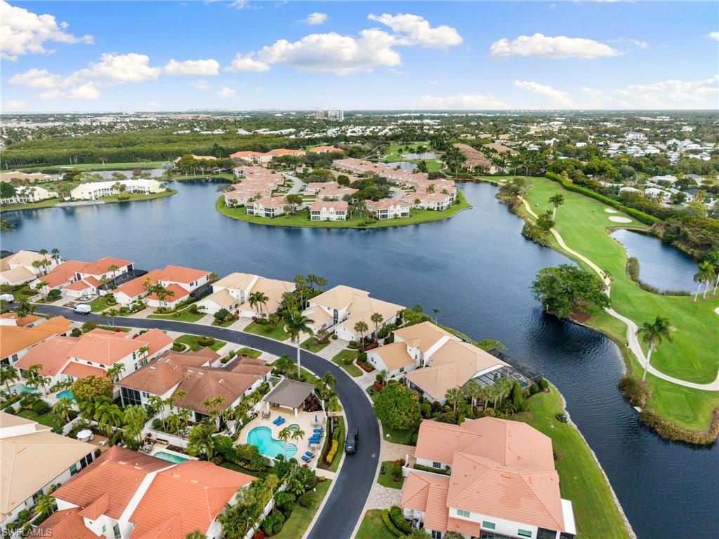 2153 Paget Circle Naples, FL 34112 - Photo 43 of 49 Aerial perspective of suburban area featuring a large body of water