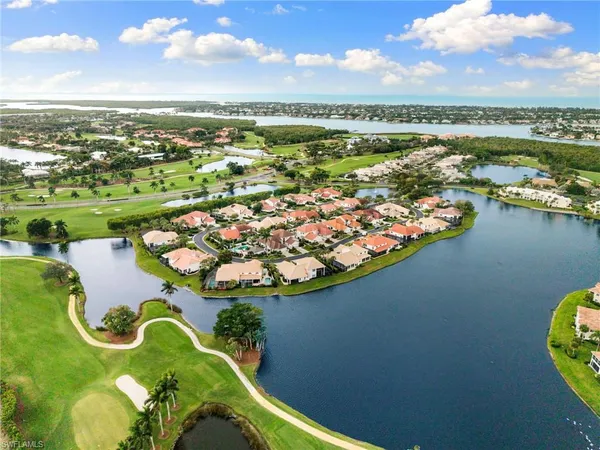 an aerial view of a house with a lake view