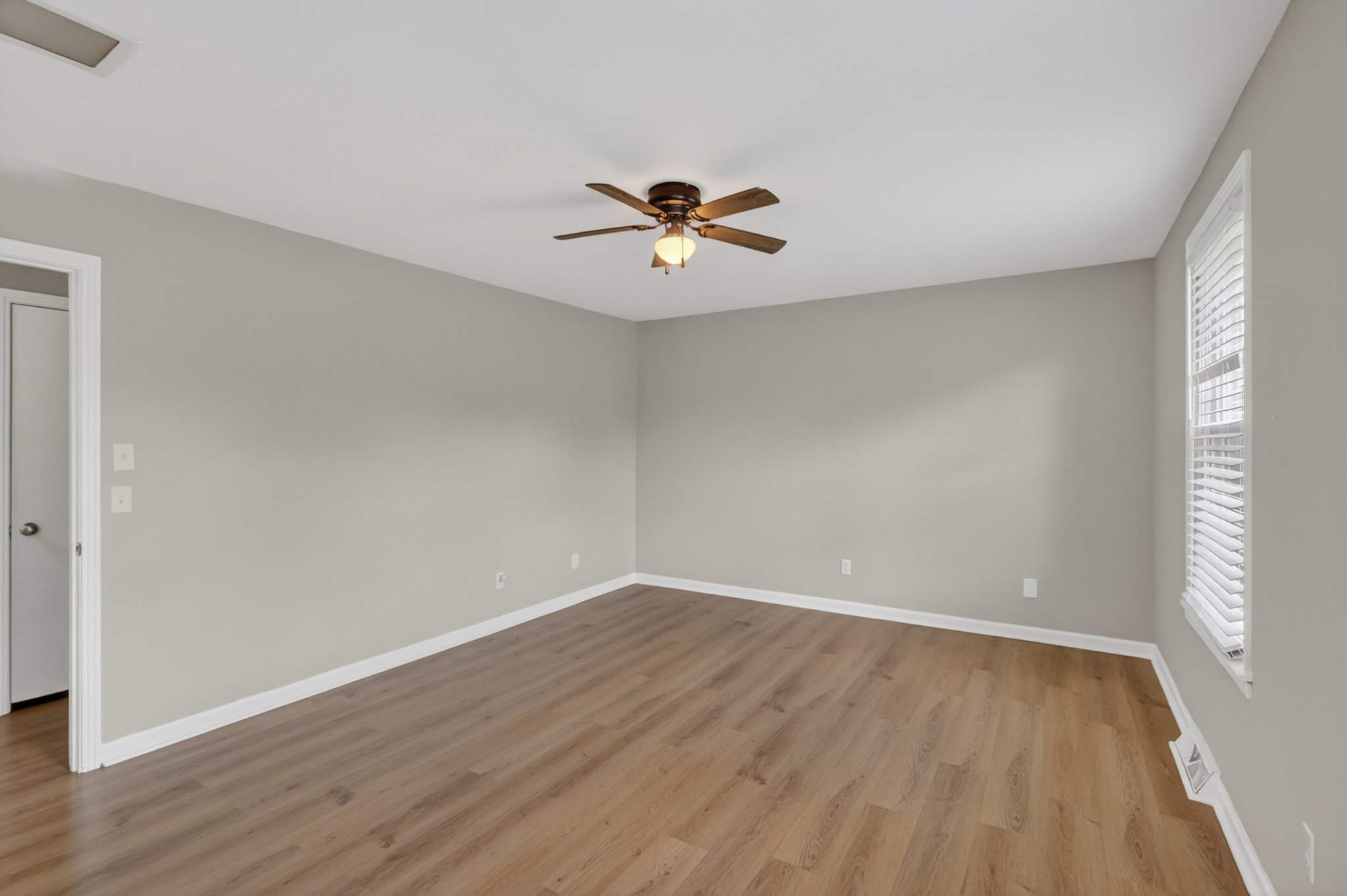 489 Canton Pass Madison, TN 37115 - Photo 10 of 25 a view of a room with wooden floor and a ceiling fan