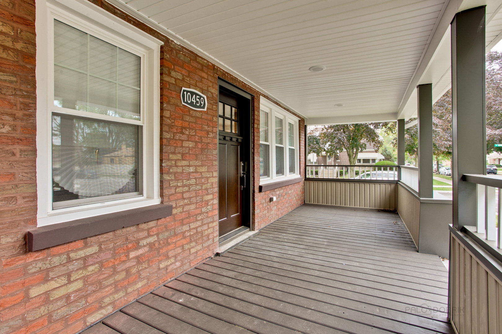 10459 South Troy Street Chicago, IL 60655 - Photo 2 of 24 a view of a hallway with wooden floor and a large window