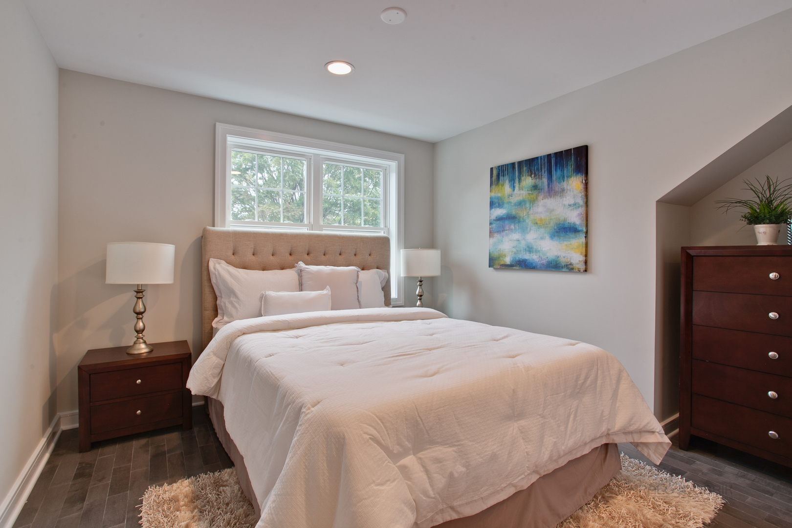 10459 South Troy Street Chicago, IL 60655 - Photo 16 of 24 a bedroom with a bed and a lamp on dresser