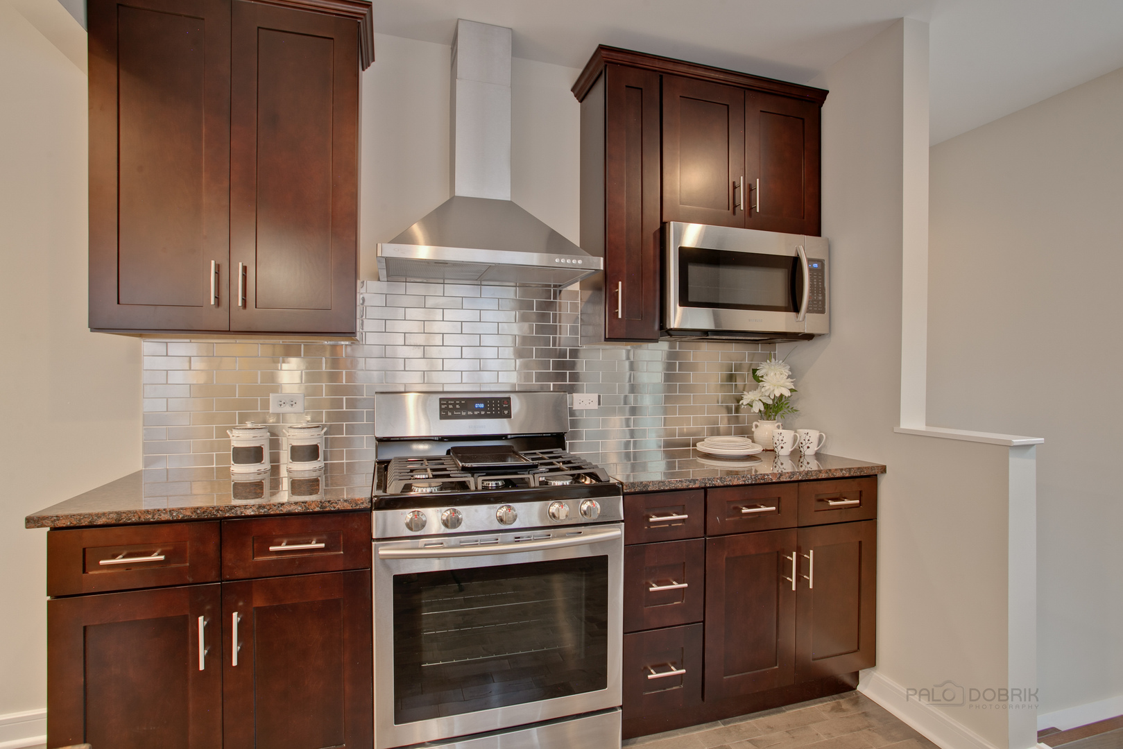10459 South Troy Street Chicago, IL 60655 - Photo 6 of 24 a kitchen with granite countertop a stove top oven microwave and cabinets