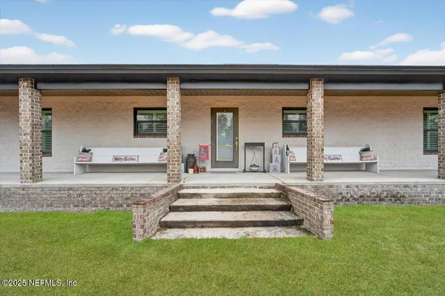 a view of a living room and kitchen