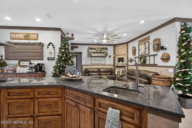 a large kitchen with stainless steel appliances kitchen island granite countertop a large counter top