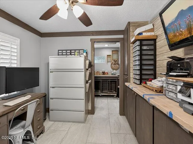 a view of a workspace with furniture