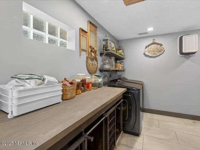 a kitchen with a stove and cabinets