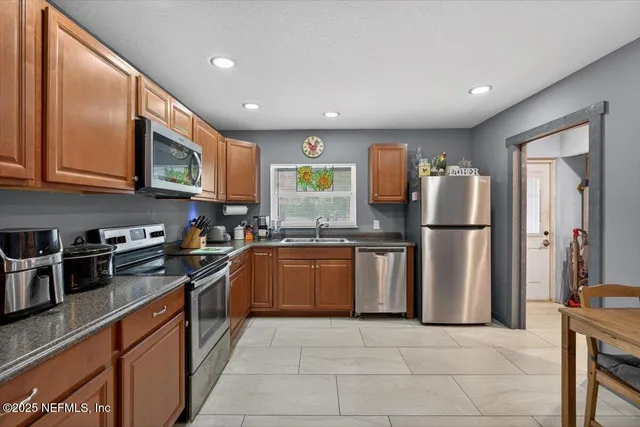 a living room with furniture a window and a couch