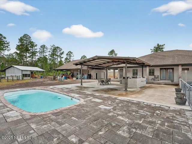 an aerial view of a houses with outdoor space