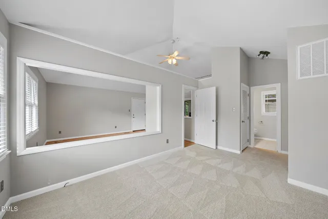 a view of an empty room with a window