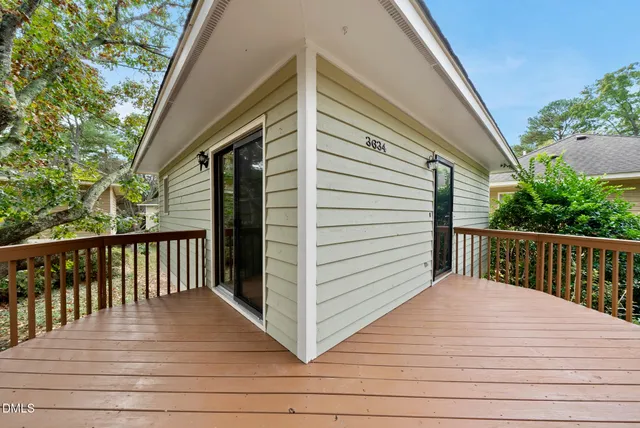a view of a balcony with wooden floor
