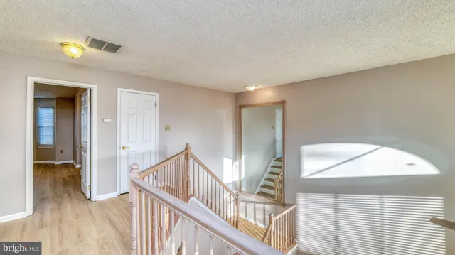 a view of a hallway with staircase