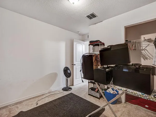 a view of workspace with wooden floor windows