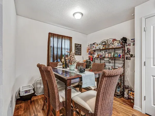 a view of a dining room with furniture and window