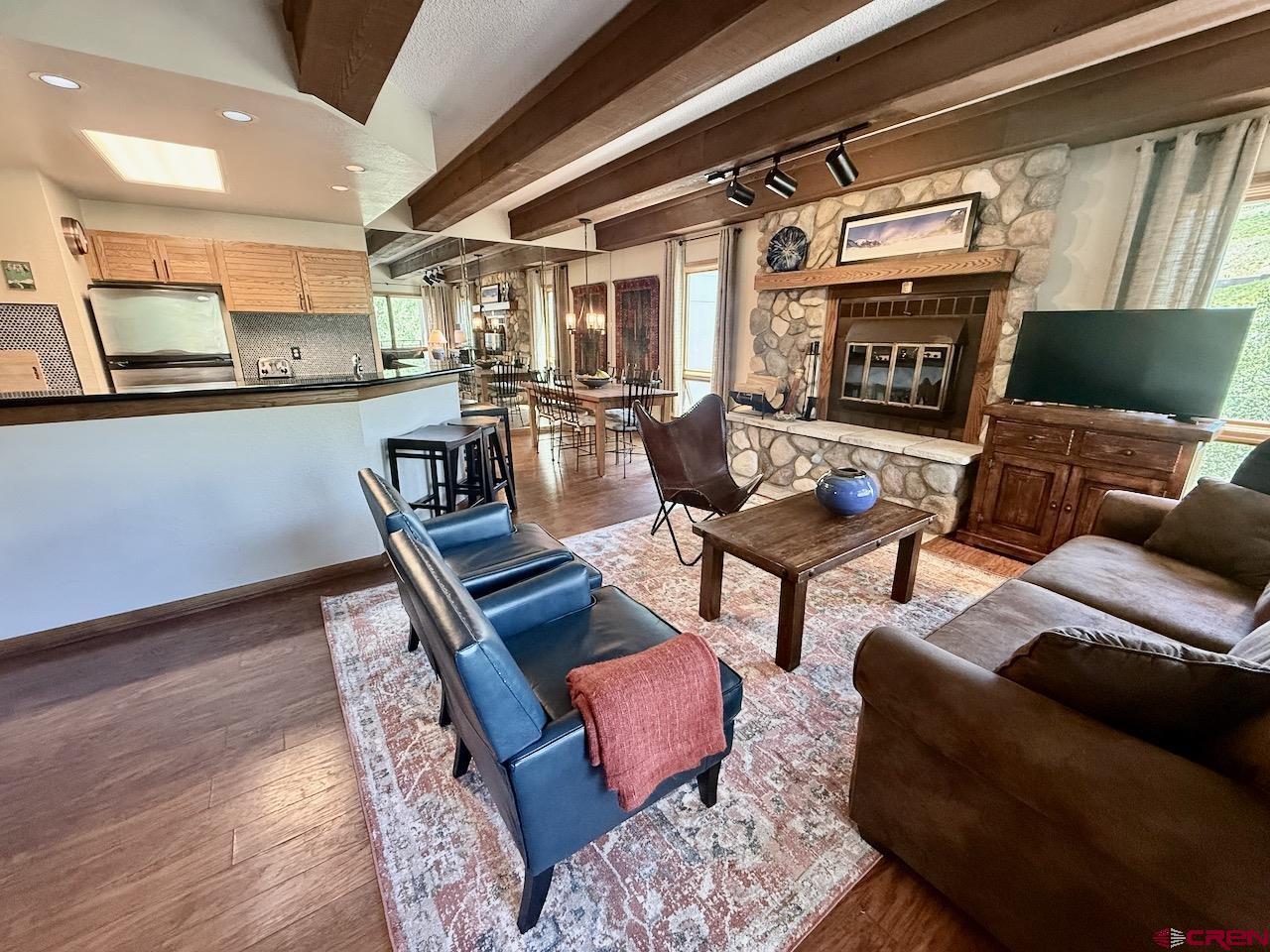 11 Snowmass Road, Unit 337 Crested Butte, CO 81225 - Photo 13 of 35 a living room with furniture and a fireplace