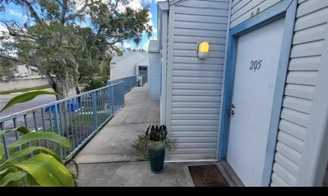 a view of street along with potted plants