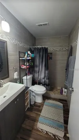 a dining room with furniture and a floor to ceiling window