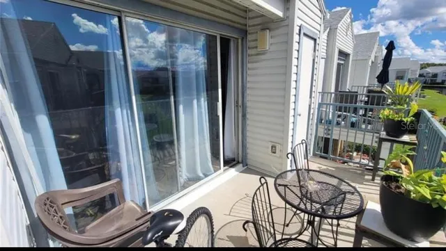 a view of a lake in the backyard of a house